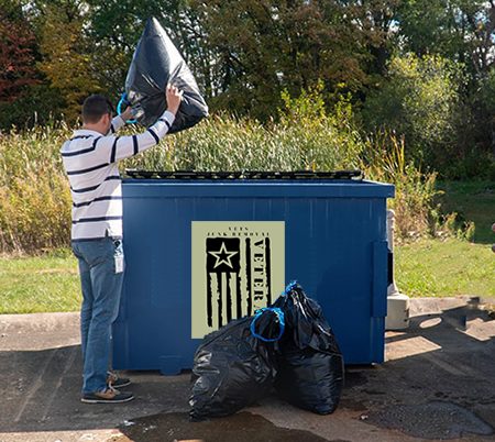Vets Junk Removal dumpster at a job site